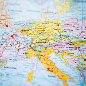 A colorful map shows European countries with labeled cities and highlighted borders, providing geographical context and information.