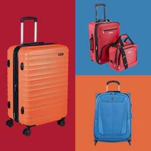 Luggage stands upright, showcasing colorful, sturdy designs against red, blue, and orange background sections. Various luggage types include an orange hard-shell and red soft-sided pieces.
