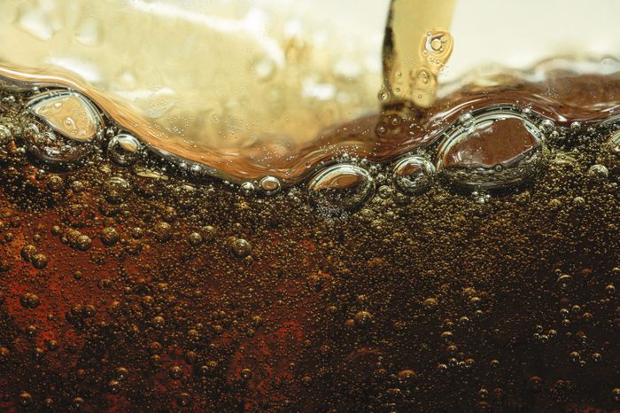 Close up soda pour