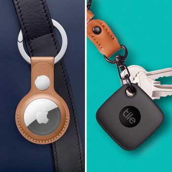 A round AirTag hangs from a leather strap on a bag, and a square Tile tracker is attached to a keychain on teal background.