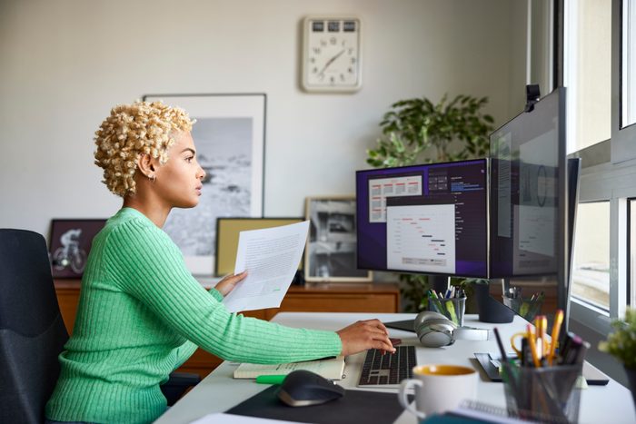 African American Confident Businesswoman Working with Document