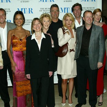 Group posing indoors; backdrop displays "The Museum of Television & Radio" logos. The setting is formal with diverse attire.