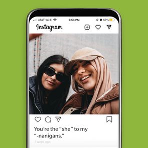 Two friends pose closely, one wearing sunglasses and the other a hijab and cap, smiling. Instagram post caption: 