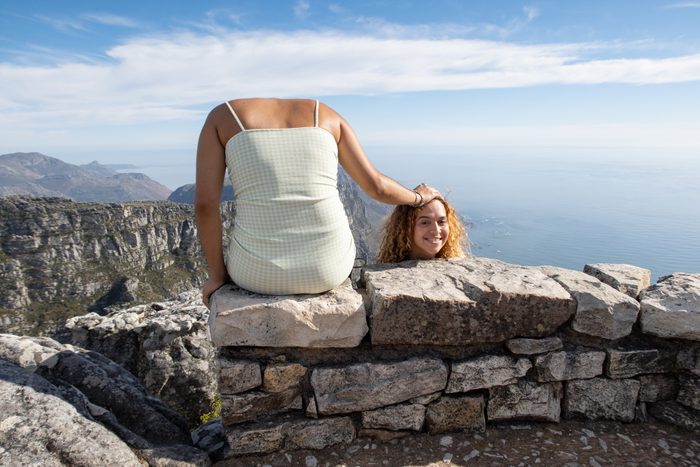 A fun picture of girl holding her head next to her