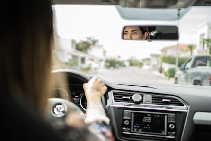 Mid adult woman driving a car