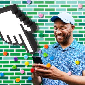 Person smiling while using a phone, surrounded by colorful pom-poms and a pixelated hand cursor, against a green tiled wall.