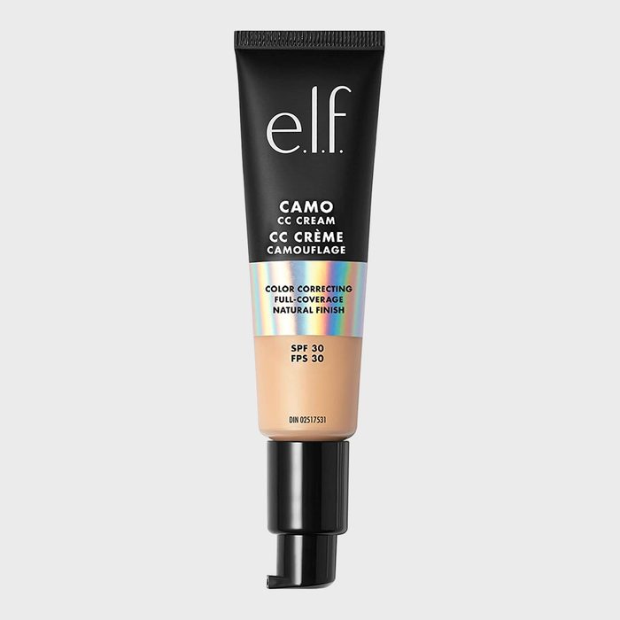 A black tube dispenses CC cream; labeled for color correcting, full coverage, natural finish, and SPF 30 protection; set against a plain background.