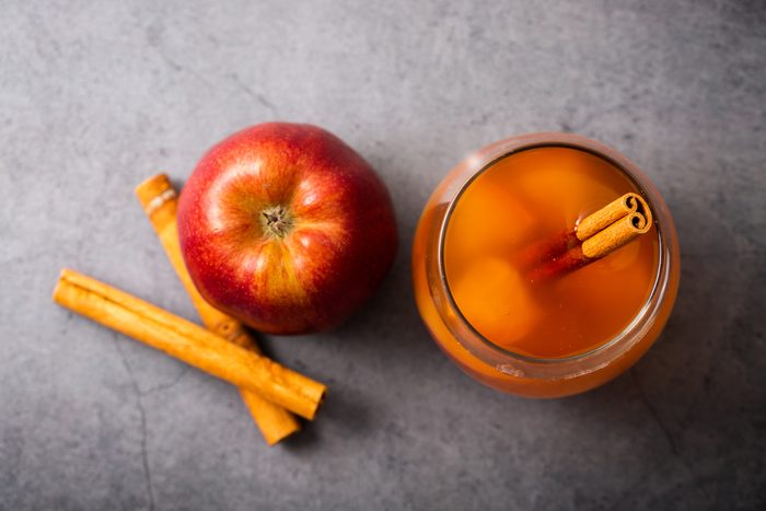 Hot Apple cider with cinnamon sticks, top view
