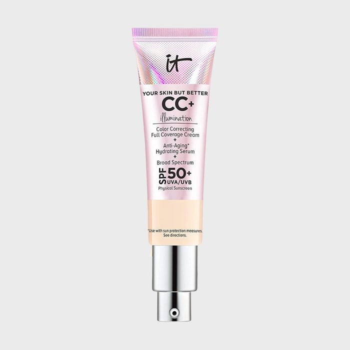 Tube displays cream focused on color correction and anti-aging, promising broad-spectrum SPF 50+ protection. Soft gradient design with silver cap and text.
