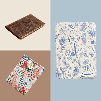 Intricately designed notebooks lay static, featuring floral patterns in various colors; one with the name "Emma" on a pale blue and beige background.