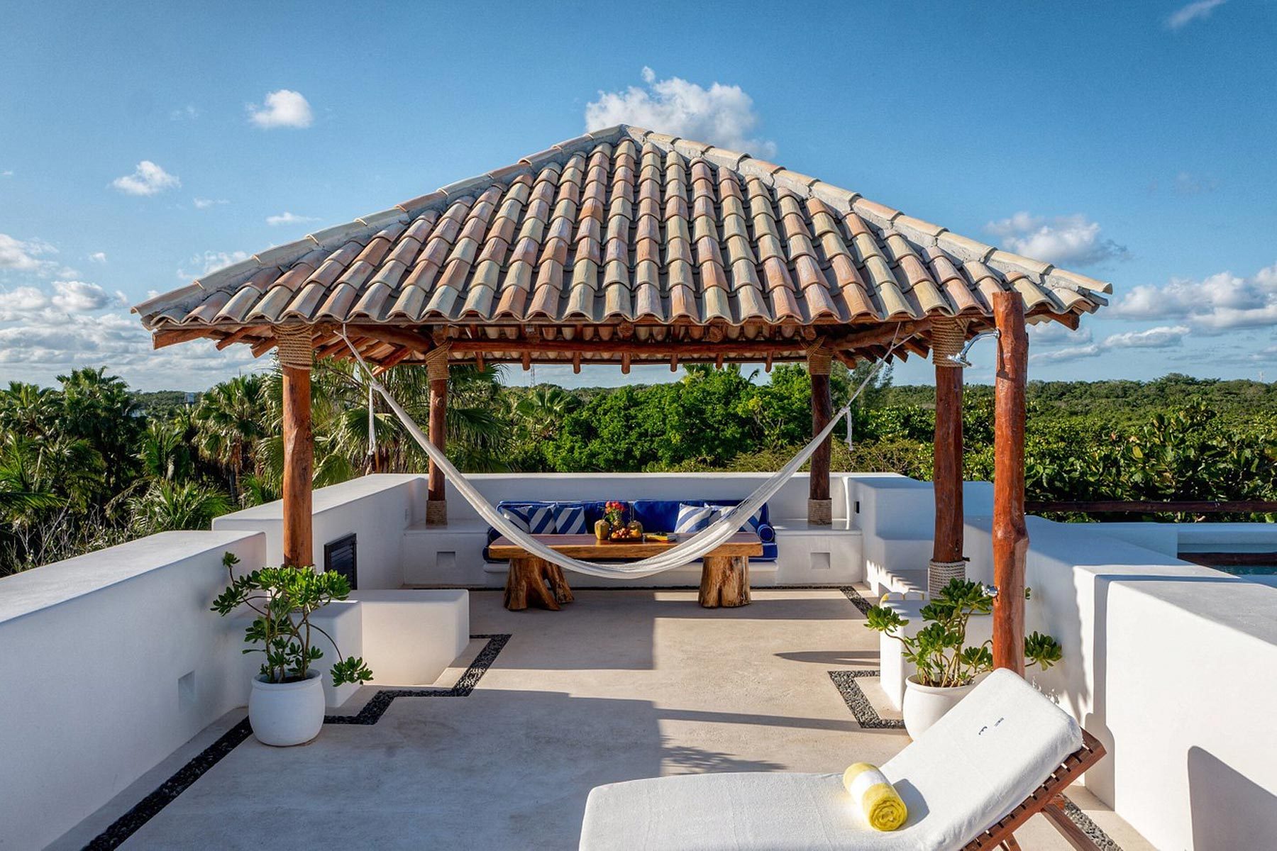 A Hammock on a Patio in Hotel Esencia 