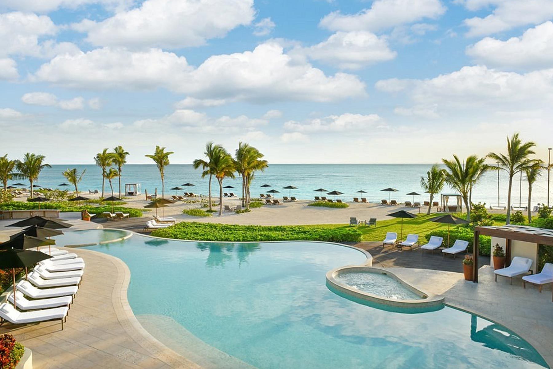Rosewood Mayakoba Resort Swimming Pool With Palm Trees and a Beach
