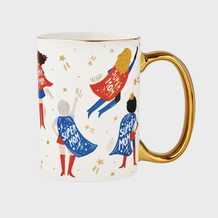 A white mug featuring illustrated caped women with 