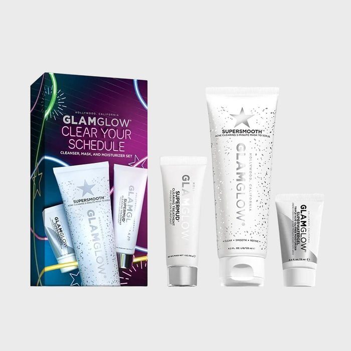 Skincare products stand upright; tubes labeled 
