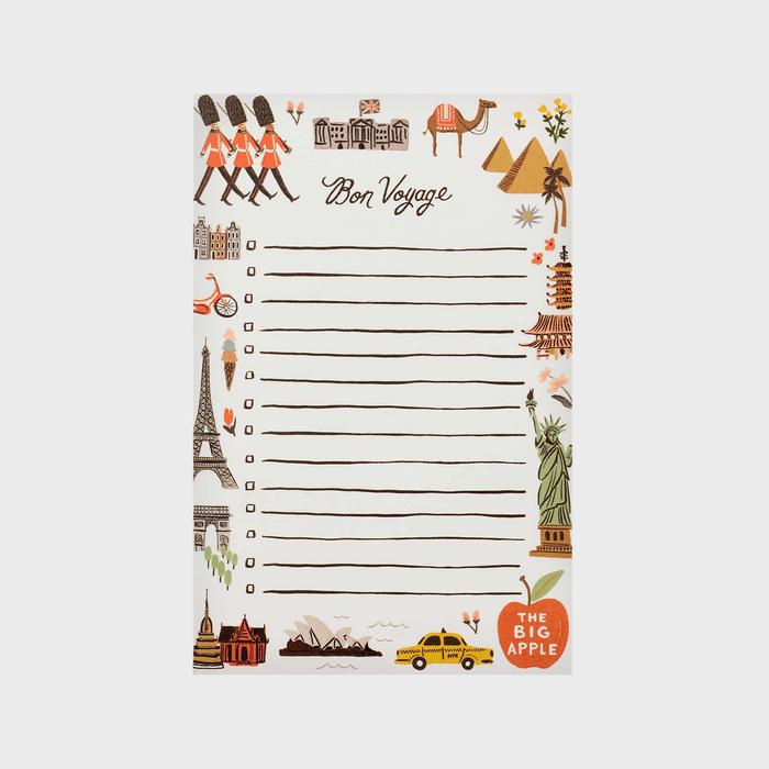 Notepad with illustrated travel-themed icons borders, featuring landmarks like Eiffel Tower and Statue of Liberty. Text reads â€œBon Voyageâ€ and â€œThe Big Apple.â€