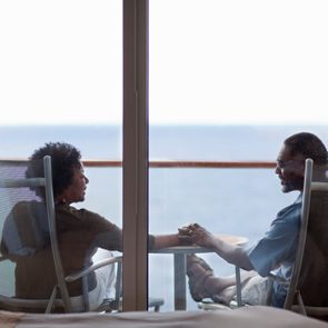 Couple outside their cruise ship bedroom