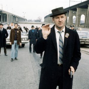 Gene Hackman waves in The French Connection