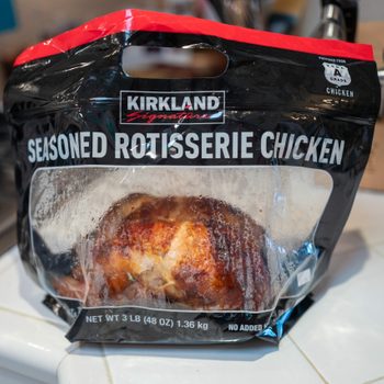 Kirkland brand rotisserie chicken from Costco, shown in plastic food service bag